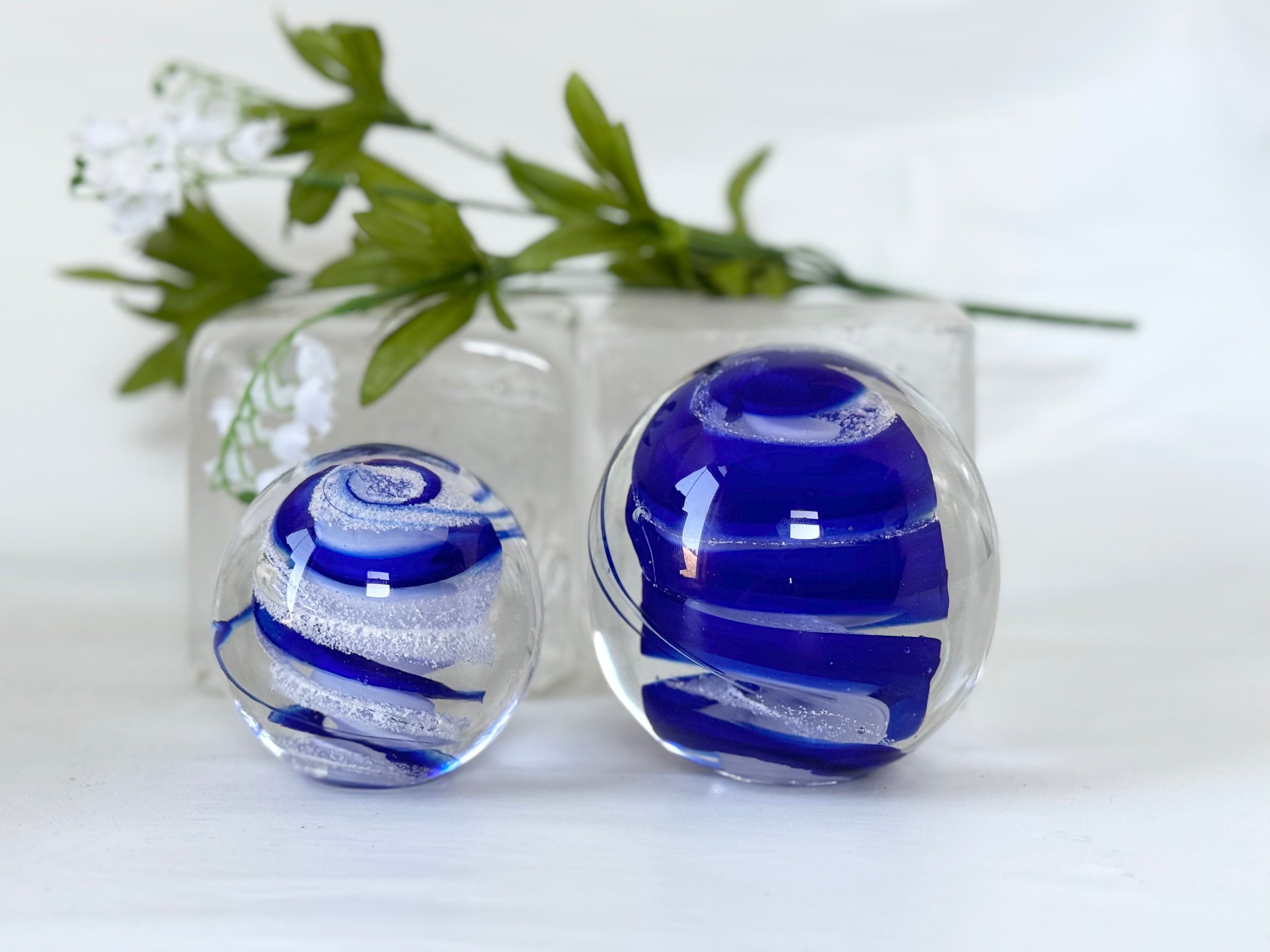 Glass “universe ball” with funeral ashes